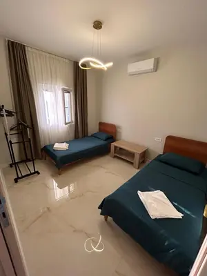 a living room with two beds and a table at Vista Boka New Luxury Apartment in Kotor in Kotor
