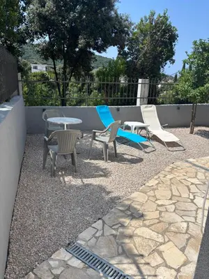a patio with chairs and a table and chairs at studio Oliva home in Utjeha