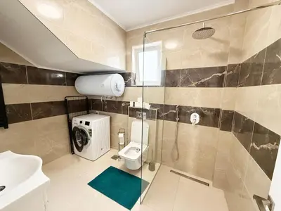 a bathroom with a shower and a toilet and a sink at Donji Stoj Rene Villa in Donji Štoj