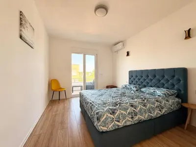 a bedroom with a blue bed in a room at Donji Stoj Rene Villa in Donji Štoj