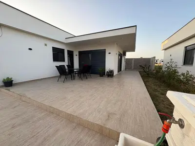 a patio with chairs and a table in a house at Luxury Villa Ulcinj Štoj in Donji Štoj