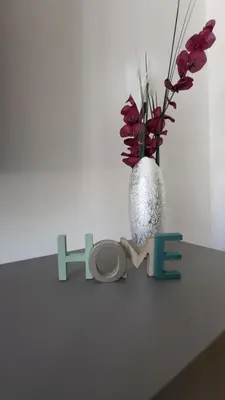 a table with a vase and the word hope at Apartman AS in Podgorica