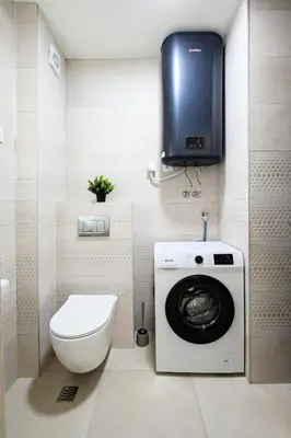 a bathroom with a washing machine and a toilet at Apartman Adriatico 10 in Bar, Susanj