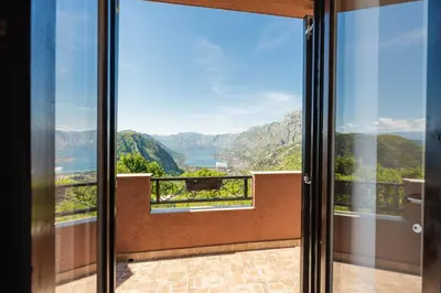 a room with a view of the mountains at Big Hill Apartment 2 in Kotor