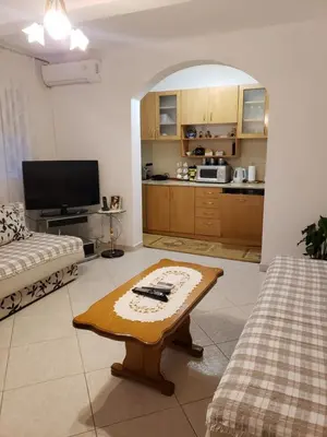 a living room with a couch and a coffee table at Отдых с комфортом и близко к морю in Bar, Susanj