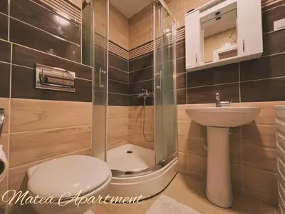 a bathroom with a shower and a toilet and a sink at Matea in Budva
