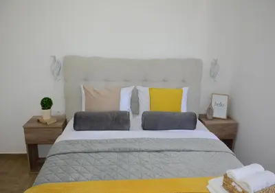 a bedroom with a large bed with two pillows at Azure Boka in Trojica