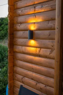 a wooden wall with a light on it at Villa Baccarat in Ulcinj