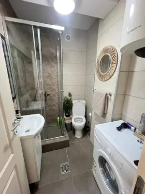 a bathroom with a shower and a toilet and a sink at Ilirija Budva Center Sea Style in Budva