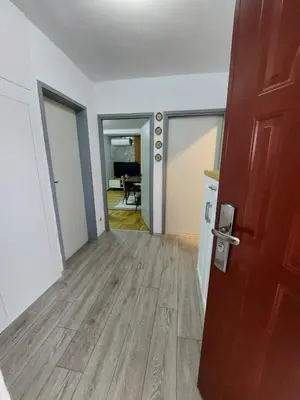 an empty room with a door and a hallway at Golden view apartman in Bar