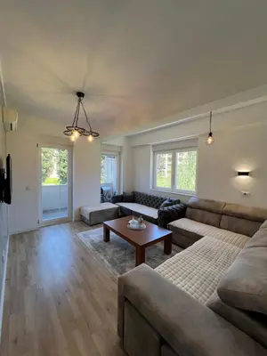 a living room with a couch and a table at Apartments Nesi in Ulcinj