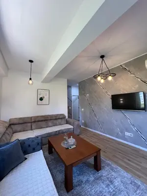 a living room with a couch and a table at Apartments Nesi in Ulcinj