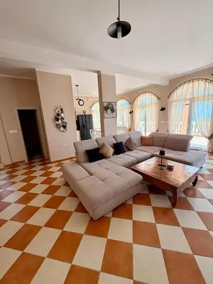 a living room with a couch and a table at Villa Sky Mountain in Bar