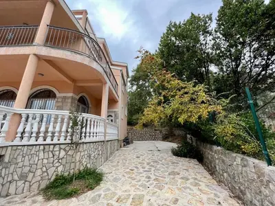 a house with a stone walkway next to a building at Villa Sky Mountain in Bar