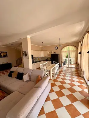 a living room with a couch and a table at Villa Sky Mountain in Bar