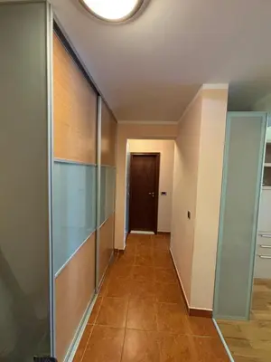 a hallway with glass doors and a hallway with a door at GO COAST Petrovac in Petrovac na Moru