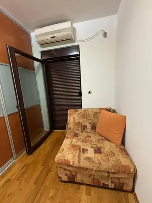 a bedroom with a bed and a air conditioner at GO COAST Petrovac in Petrovac na Moru