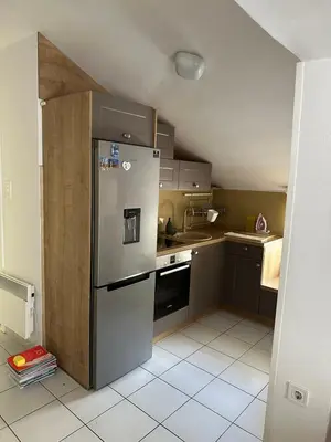 a kitchen with a stainless steel refrigerator in it at Apartman Mimi in Budva