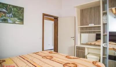 a bedroom with a bed and a bunk room at Lotos - family stan in Bar
