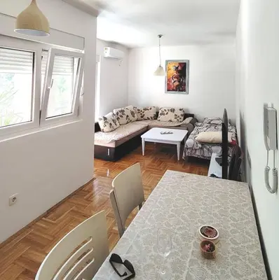 a living room with a couch and a table at Apartments Lučijana in Budva