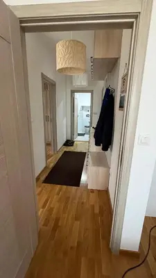 a hallway with a hallway leading to a living room at Penthouse Becici in Budva