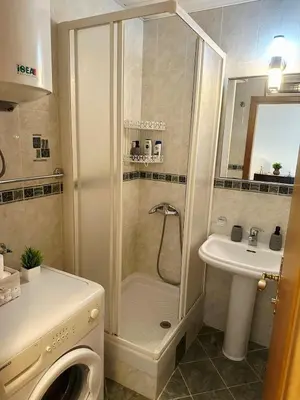 a bathroom with a shower and a sink at Sun Apartment in Petrovac na Moru