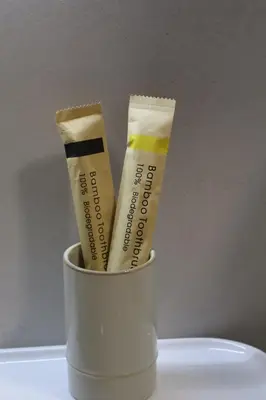 a cup with two ice cream sticks in it at Fighen Apartment in Budva
