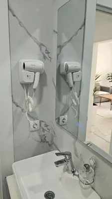 a bathroom with a sink and a mirror at Apartments Liards in Ulcinj