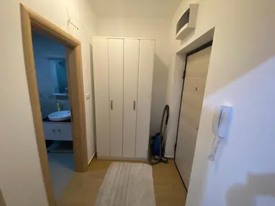 a bathroom with a white cabinet and a sink at Apartman Podgorica in Podgorica