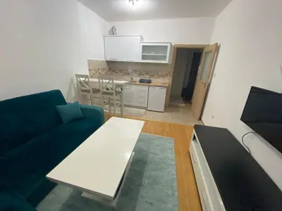 a living room with a couch and a table at Apartman Podgorica in Podgorica