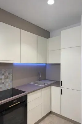 a kitchen with white cabinets and a sink at Libertina Rafailovici in Rafailovici