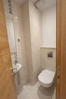 a bathroom with a toilet and a sink at Libertina Rafailovici in Rafailovici