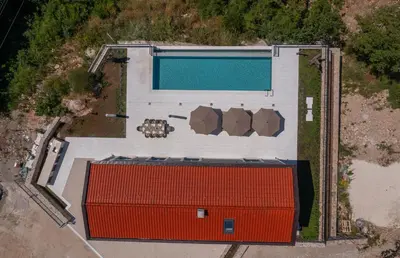 an overhead view of a building with a swimming pool at Villa Zvis Sea View with Private Pool & Peaceful Stay in Budva