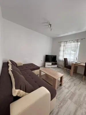 a living room with a couch and a table at Apartment Matija in Cetinje