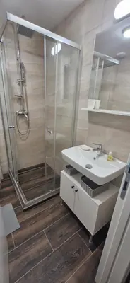 a bathroom with a shower and a sink at kotor apartman 3 in Kravlja