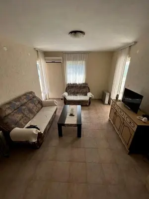 a living room with a couch and a coffee table at Seaside Ilino in Bar