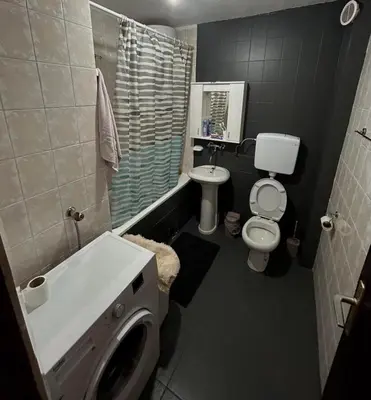 a bathroom with a sink and a toilet and a shower at Seaside Ilino in Bar