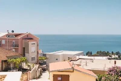 a view of a town with the ocean in the background at Dani Deluxe Apartments in Ulcinj