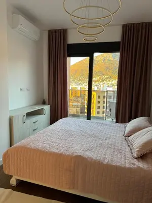 a bedroom with a large bed and a large window at Soho CIty 808A in Bar