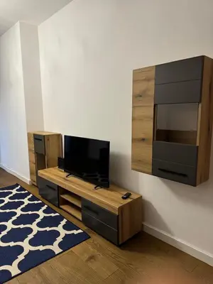 a living room with a flat screen tv on a wall at Soho CIty 808A in Bar