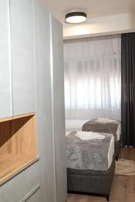 a room with two beds and a window at AndArt Heaven in Ulcinj