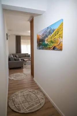a living room with a couch and a painting on the wall at AndArt Heaven in Ulcinj