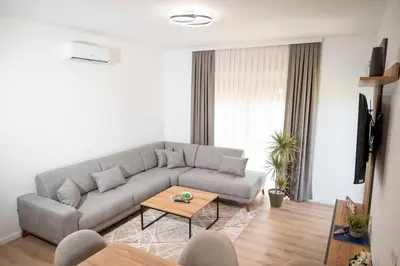 a living room with a couch and a table at AndArt Heaven in Ulcinj