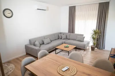 a living room with a couch and a table at AndArt Heaven in Ulcinj