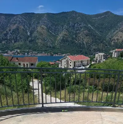 a view of a city with mountains in the background at ZEN Studio Apartman in Kotor