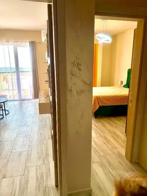 a room with a room with a bed and a hallway at Sunny Hills Apartment in Seoca