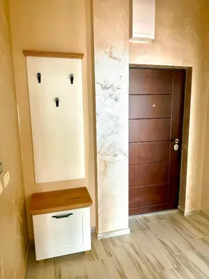 a door with a face drawn on it in a hallway at Sunny Hills Apartment in Seoca