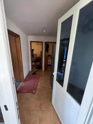 a hallway of a house with a door and a room at Apartman Adea in Donji Štoj