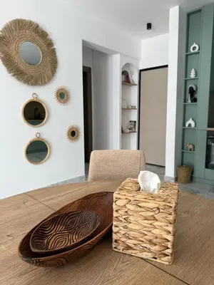 a living room with a table and a chair at Stylish Coastal Apartment in Kotor