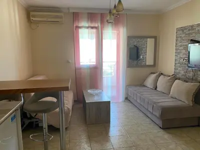 a living room with a couch and a table at Budva in Budva